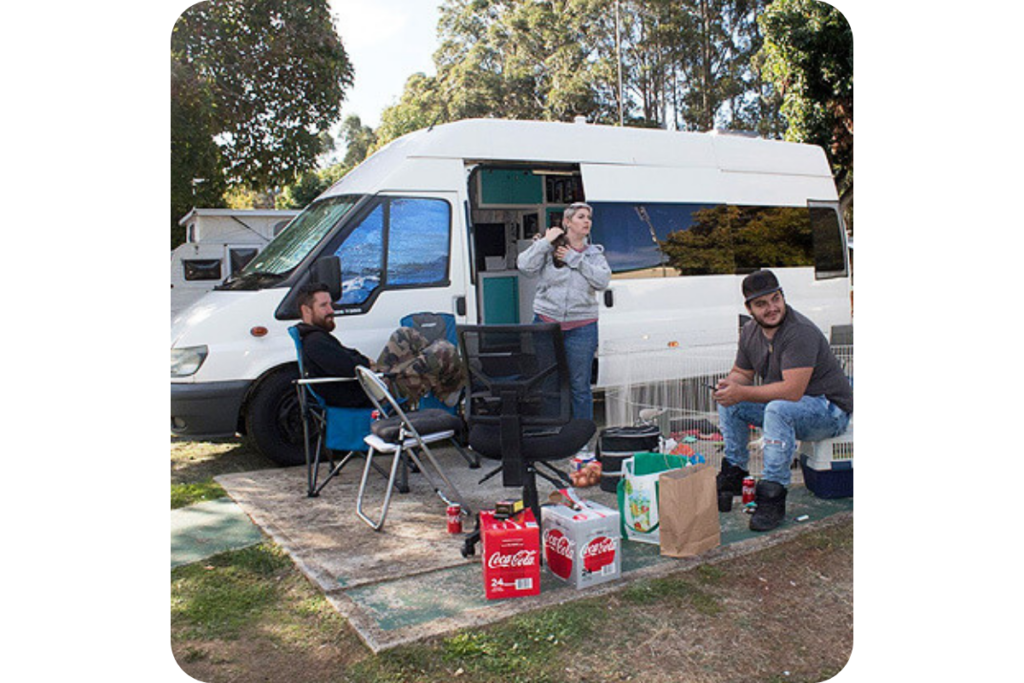 Elle, Craig, and friends gather around their van.